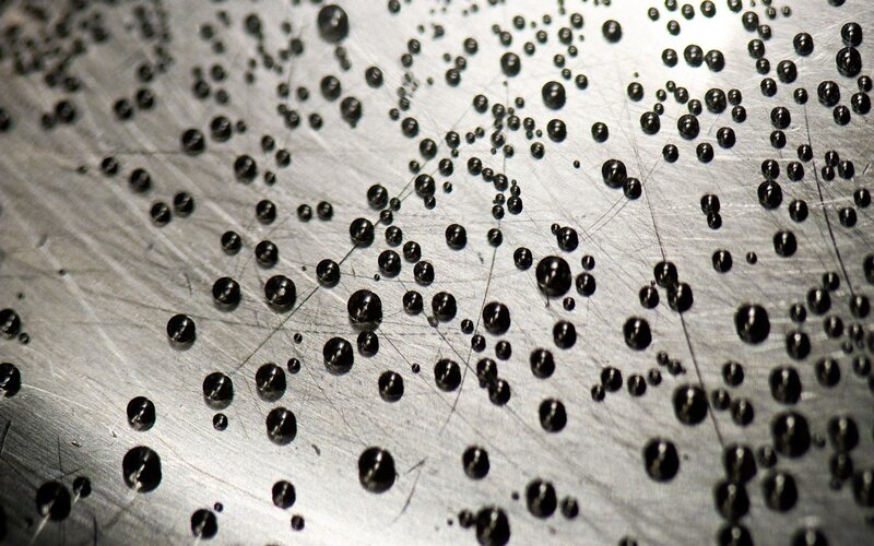 Black Droplets on Metal