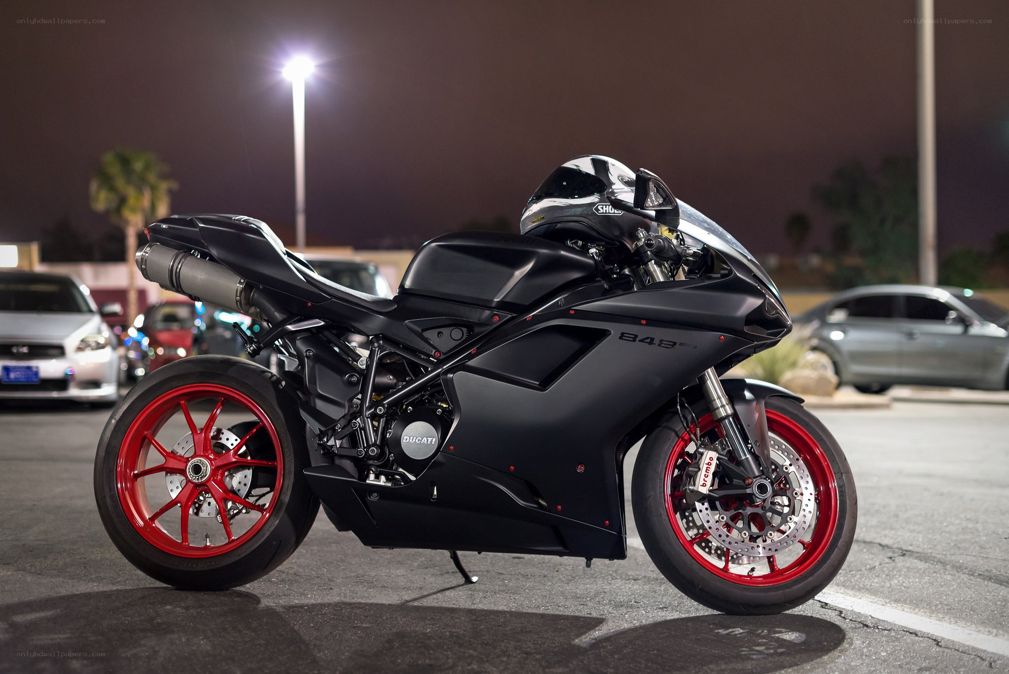 Black Ducati motorcycle at night