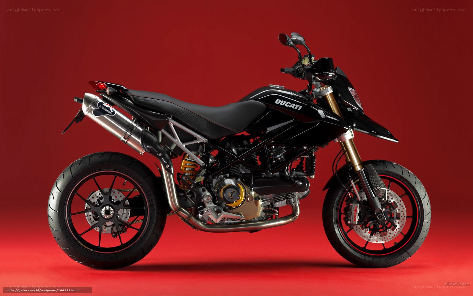 Black Ducati motorcycle on red