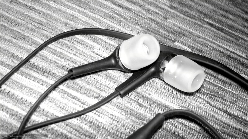 Black Earbuds on Fabric