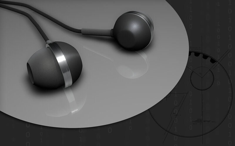 black earbuds on reflective surface