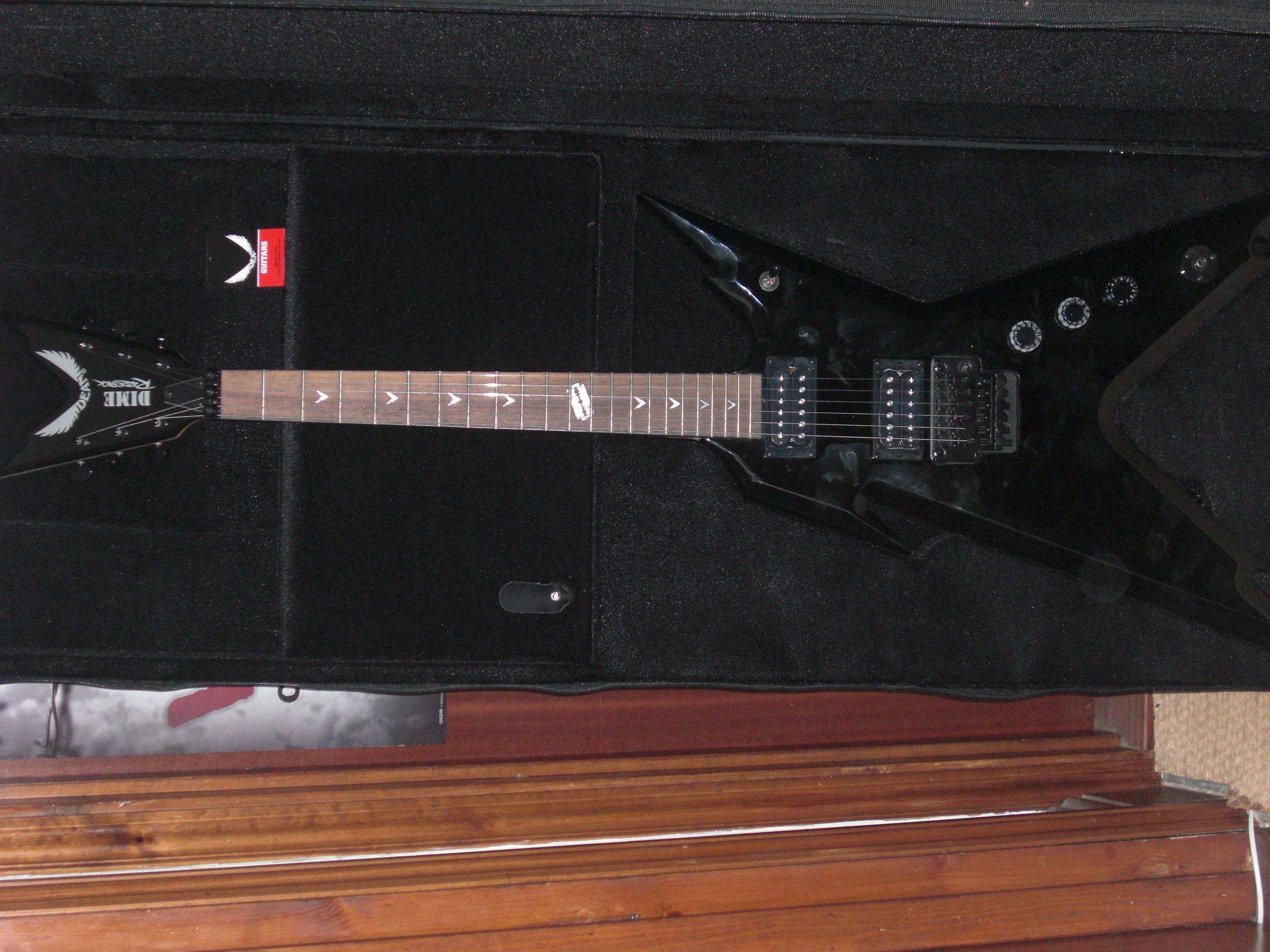 black electric guitar in case