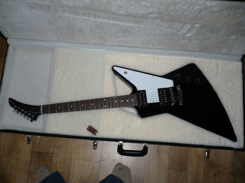 black electric guitar in case