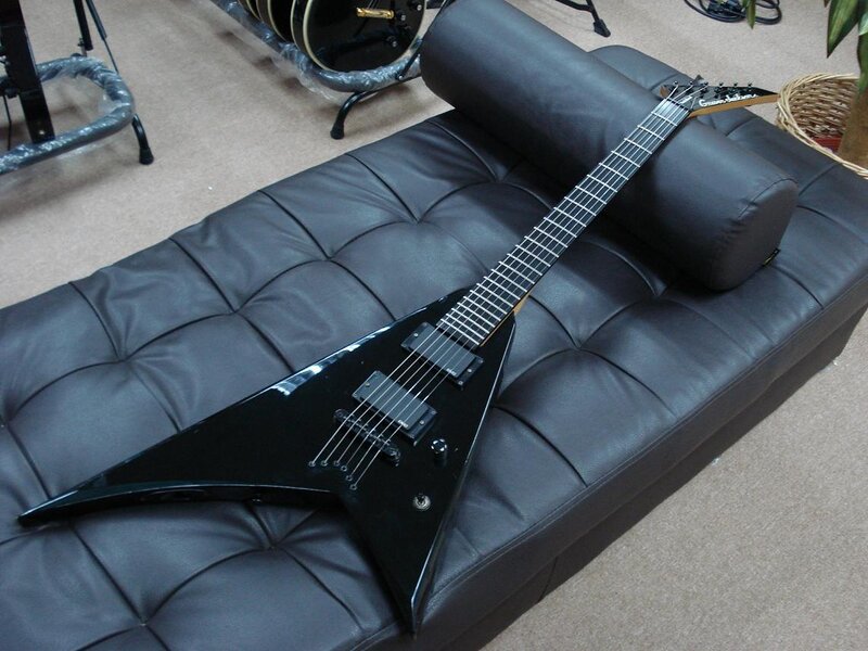 Black Electric Guitar — Neutral, Photograph