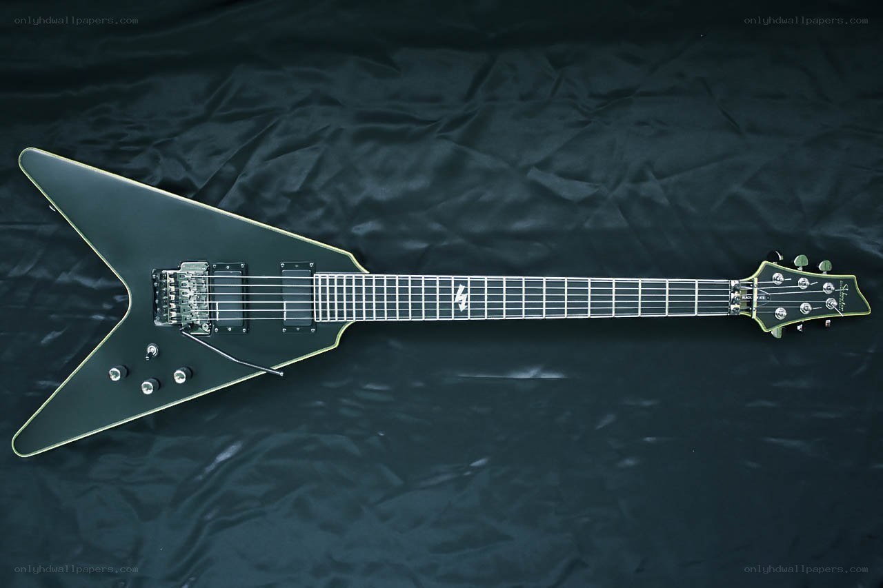 black electric guitar on black background