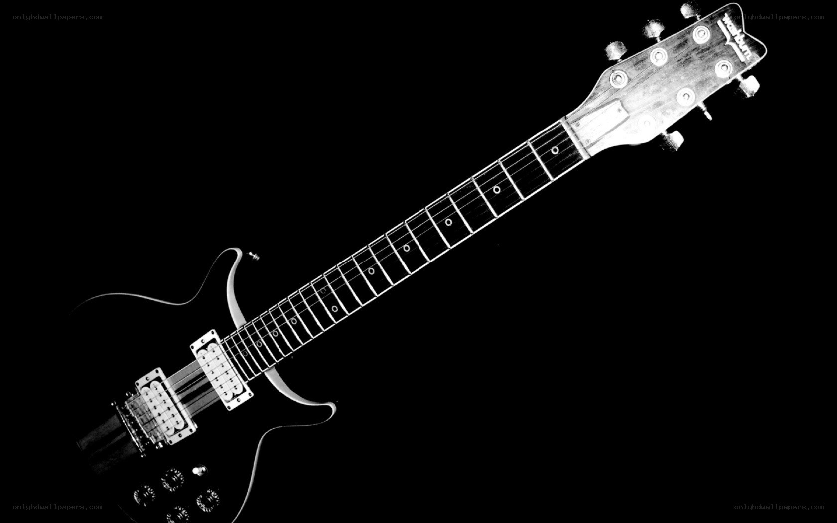 black electric guitar on black background