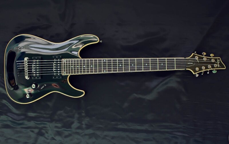 black electric guitar on black cloth