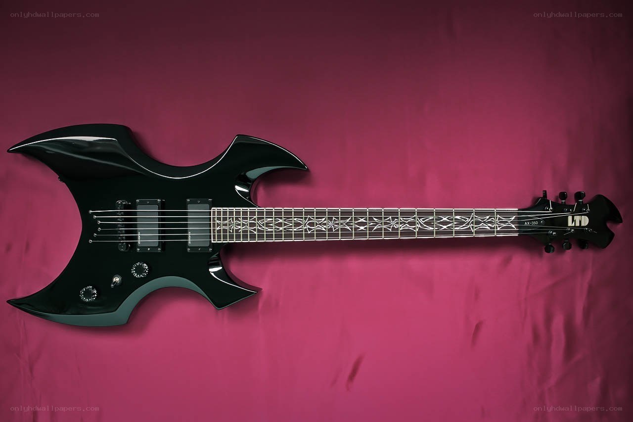 black electric guitar on pink