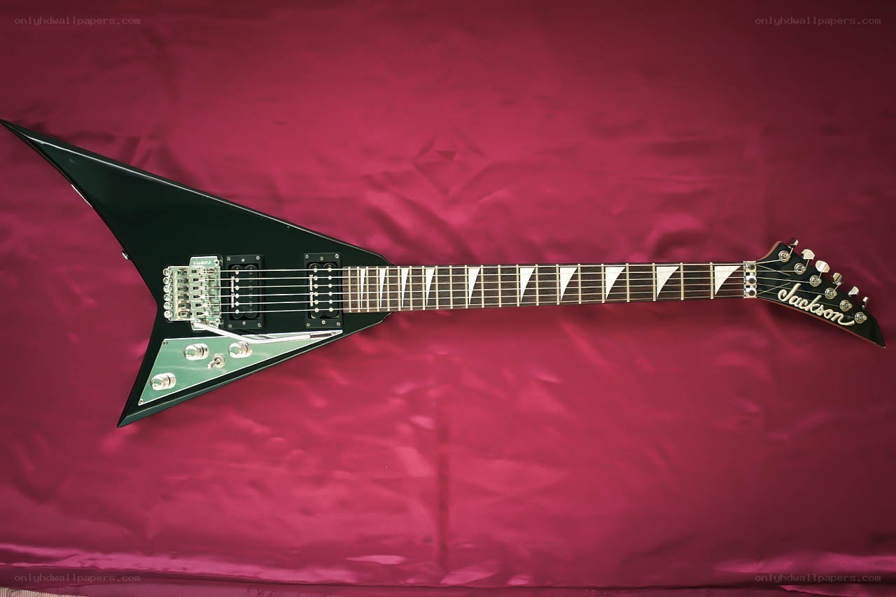 black electric guitar on red