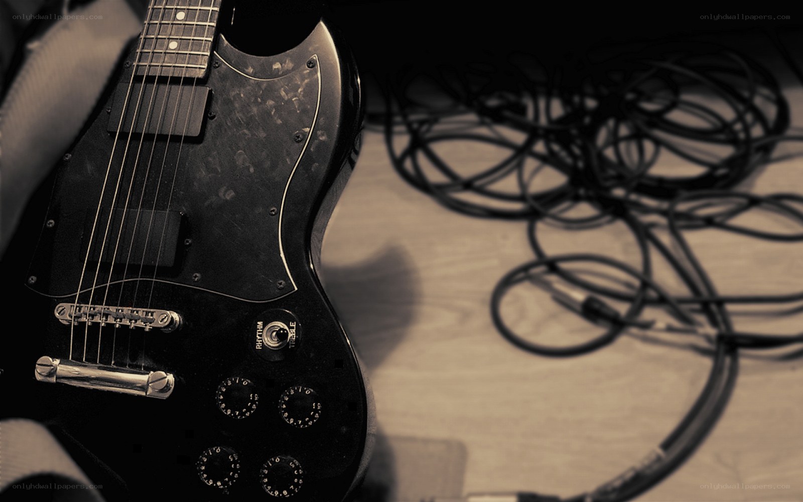 black electric guitar on table