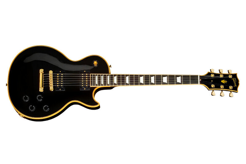 black electric guitar with gold trim