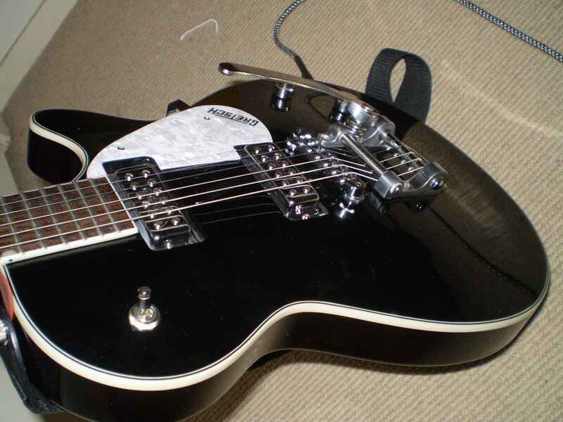 black electric guitar with tremolo