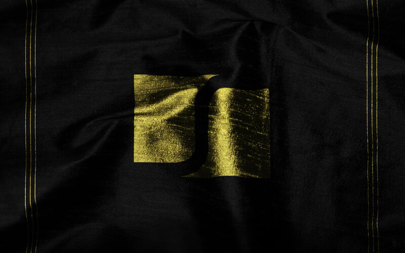 black fabric with gold logo