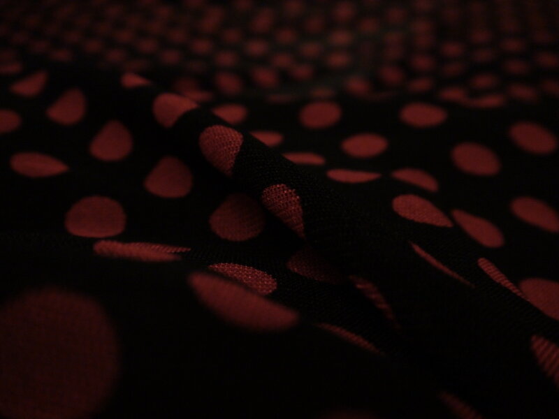 black fabric with red polka dots