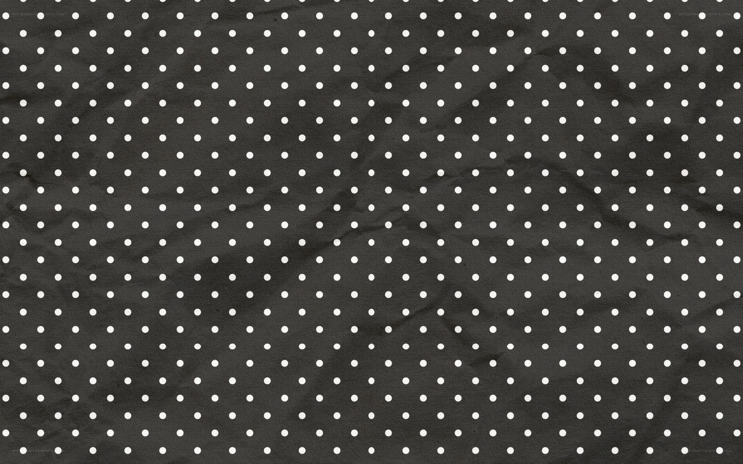black fabric with white polka dots