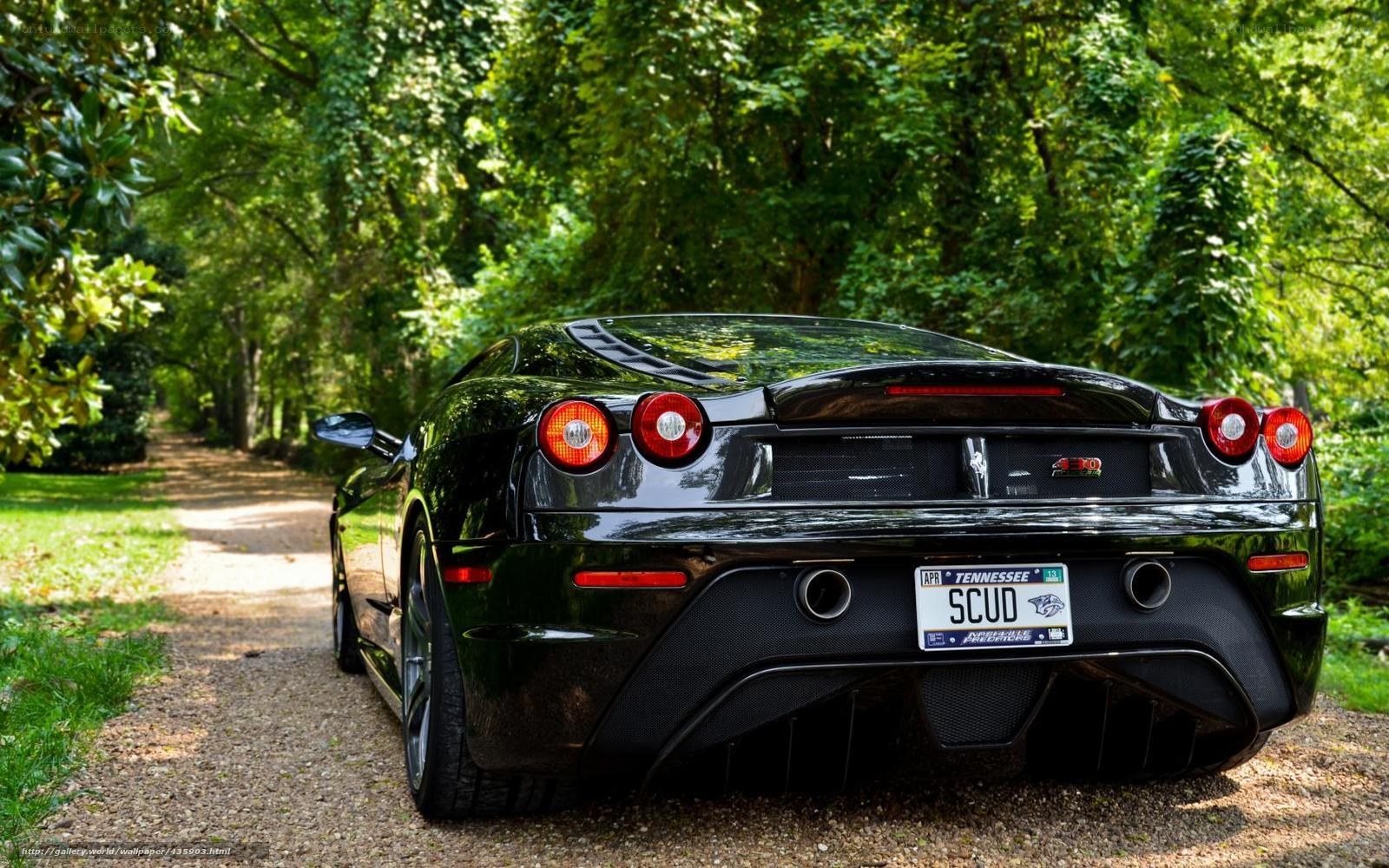 Black Ferrari 430 on a forest path