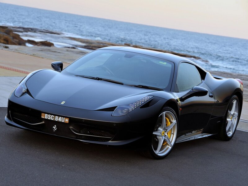 Black Ferrari 458 Italia by the sea