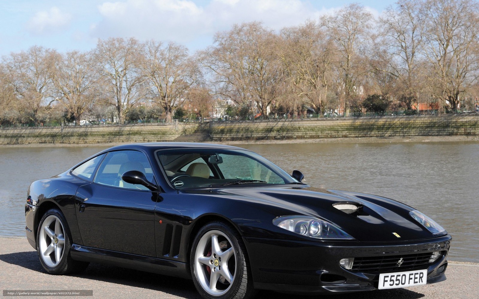 Black Ferrari 550 Maranello by river