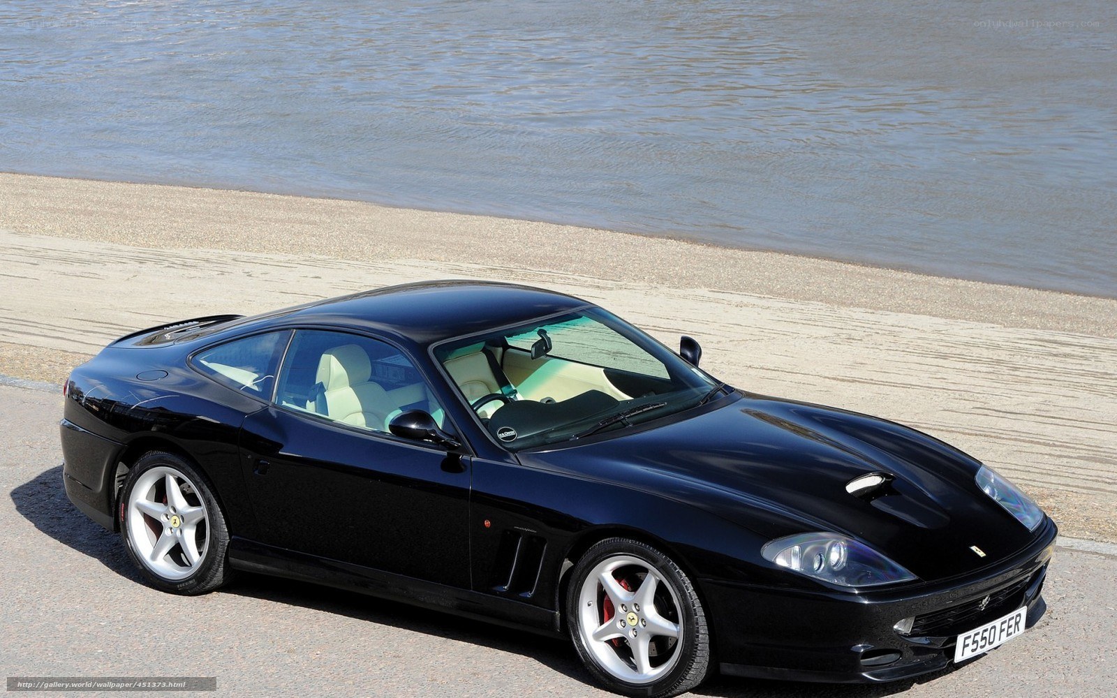 Black Ferrari 550 Maranello by water