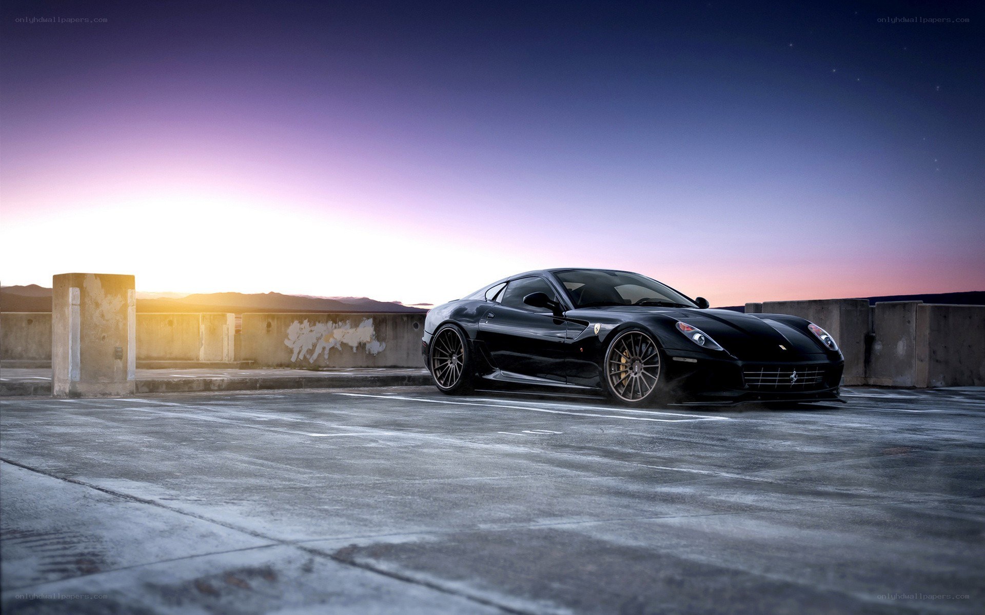 black ferrari at sunset