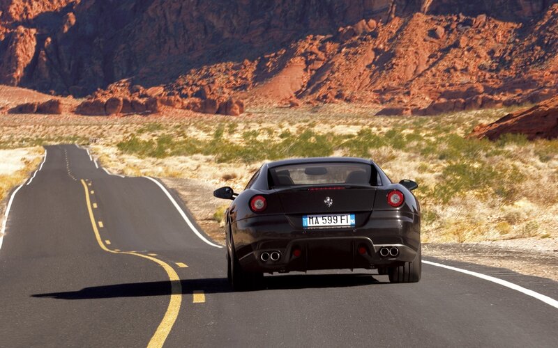 Black Ferrari Car — Dramatic, Afternoon, Photograph, Road, Mountains