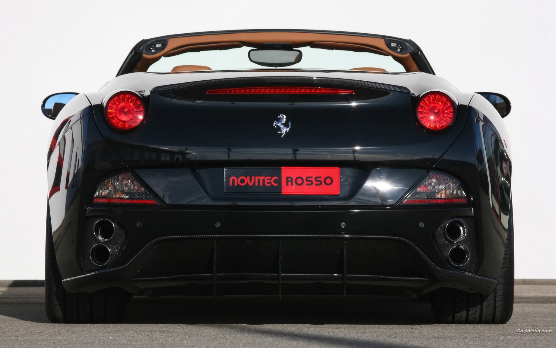 black ferrari convertible rear view