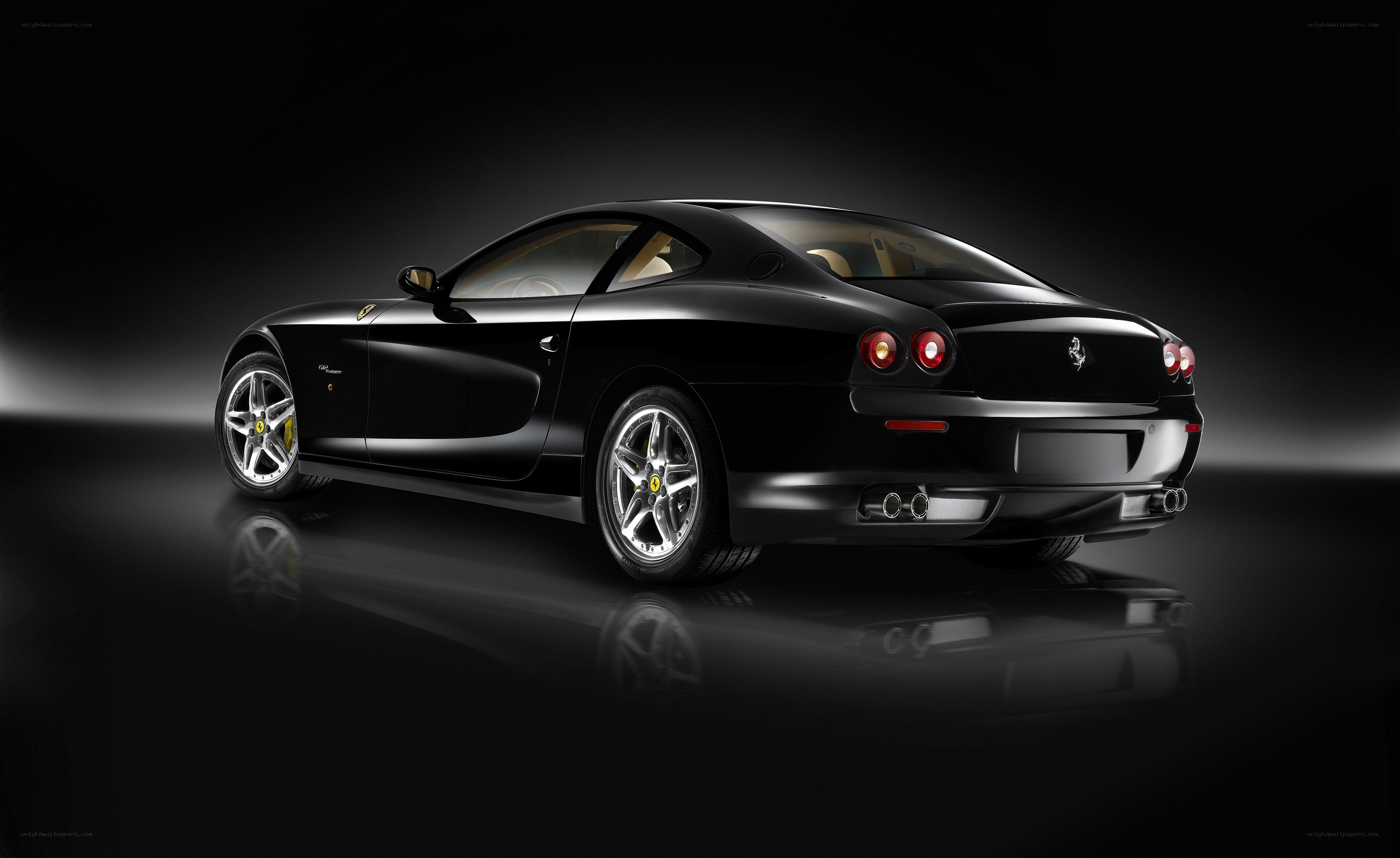 black ferrari coupe rear view