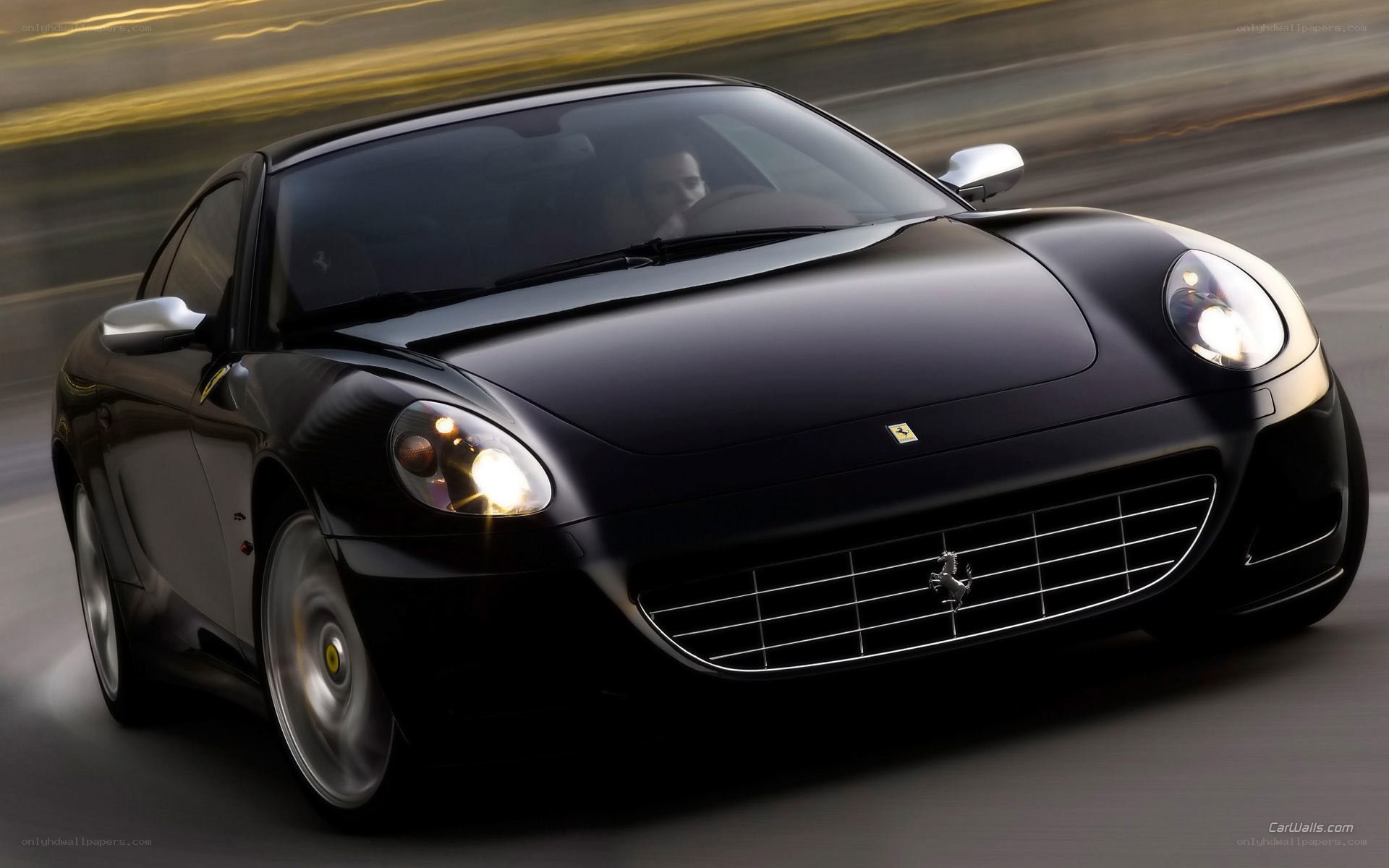 Black Ferrari driving at night