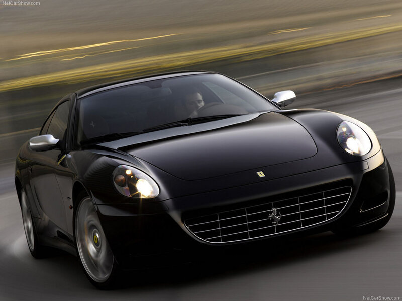 black ferrari driving fast