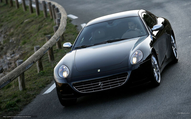 black ferrari driving on road