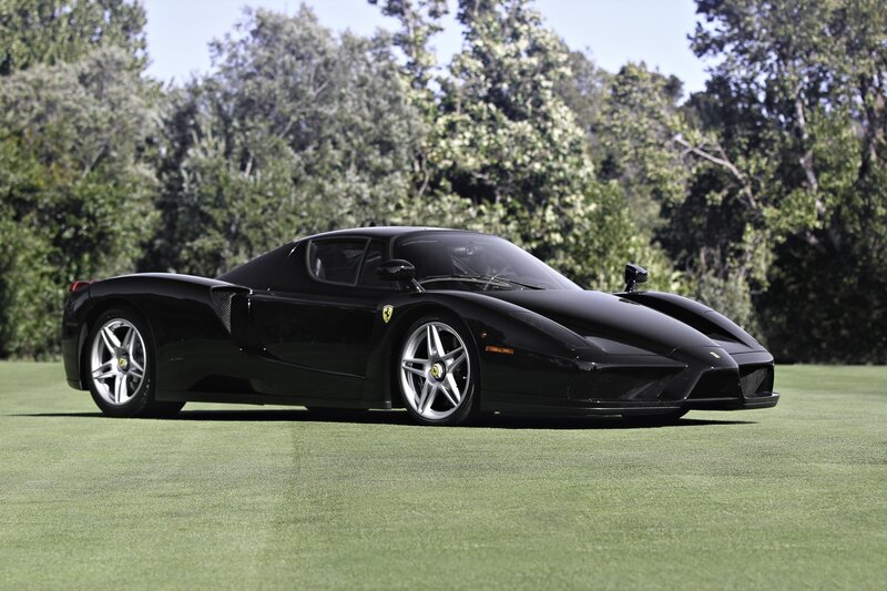 Black Ferrari Enzo on a golf course