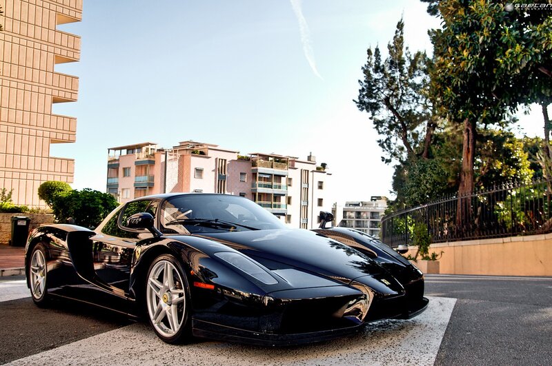 Black Ferrari Enzo on city street