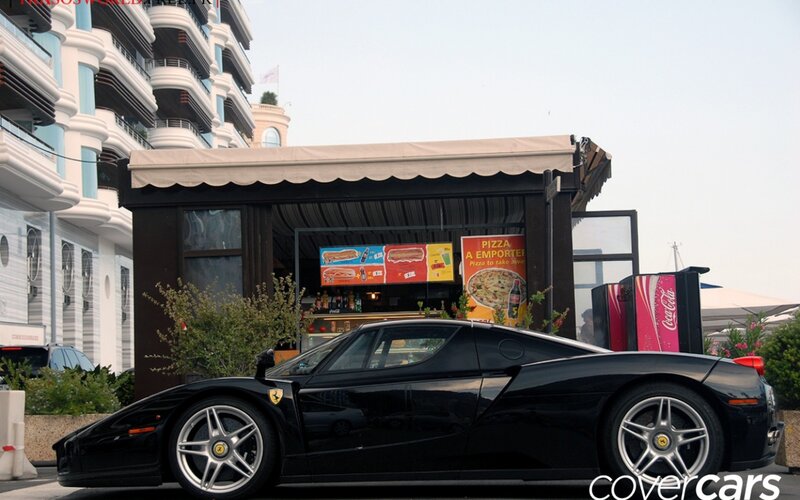 Black Ferrari Enzo parked outside