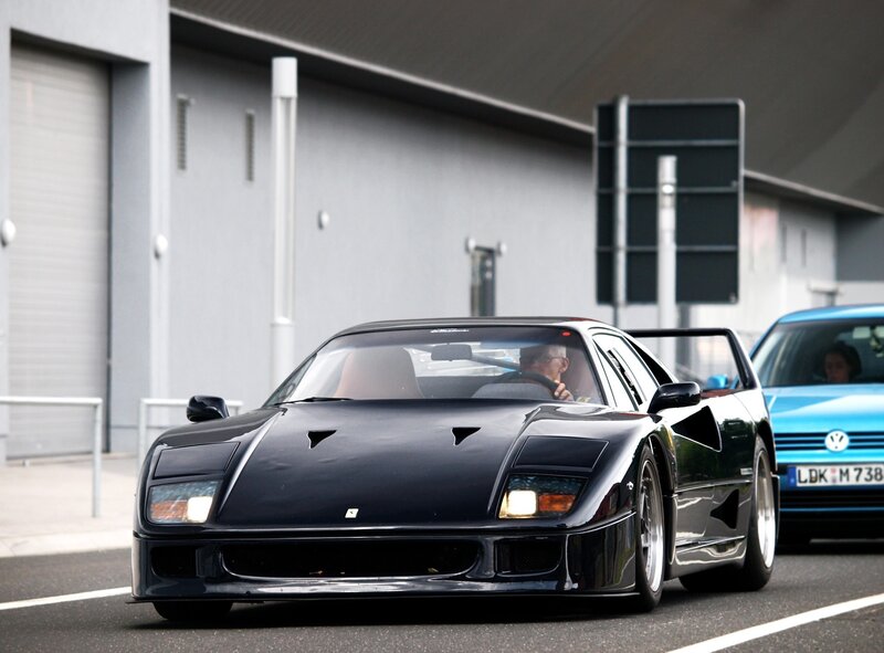 Black Ferrari F40 on a road