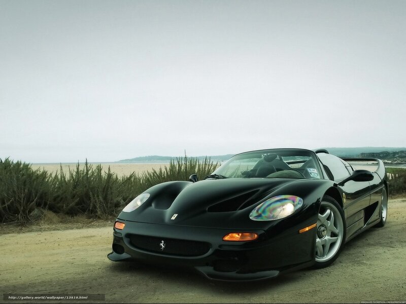 Black Ferrari F50 on beach road