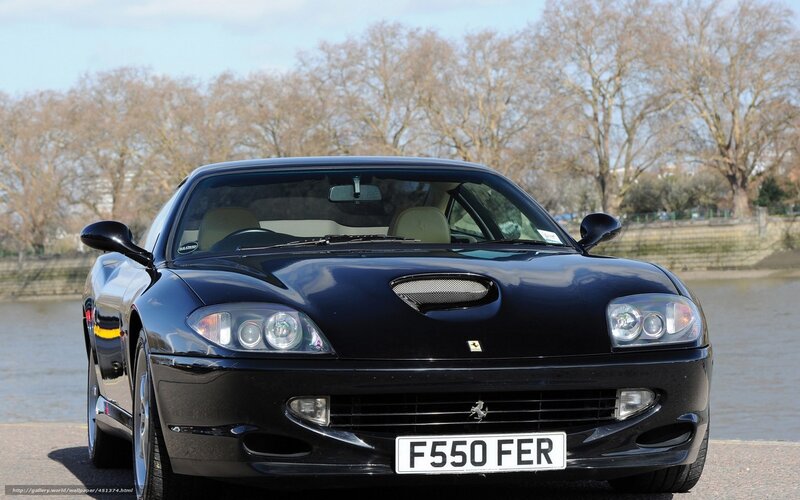 Black Ferrari F550 parked by river