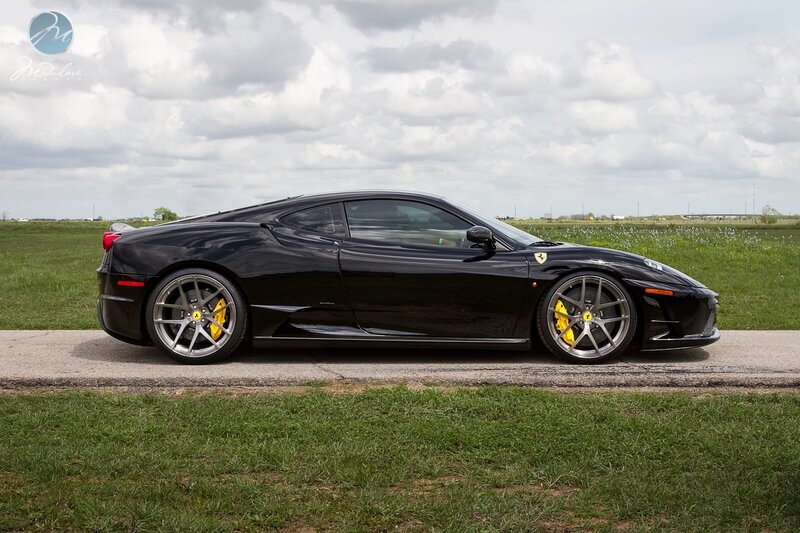 Black Ferrari in a field
