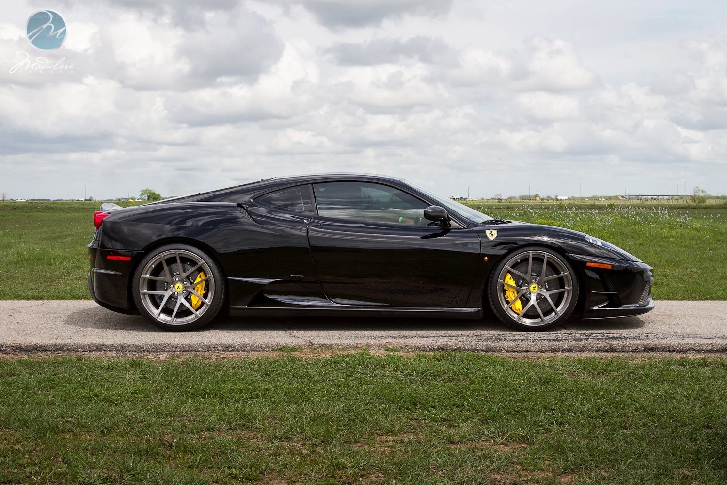 Black Ferrari in a field