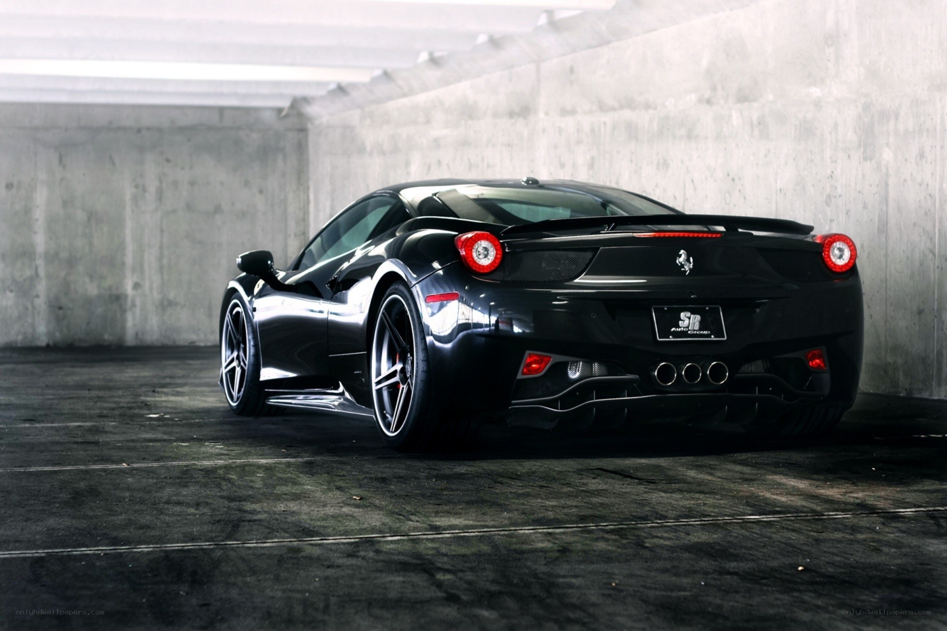 Black Ferrari in a garage