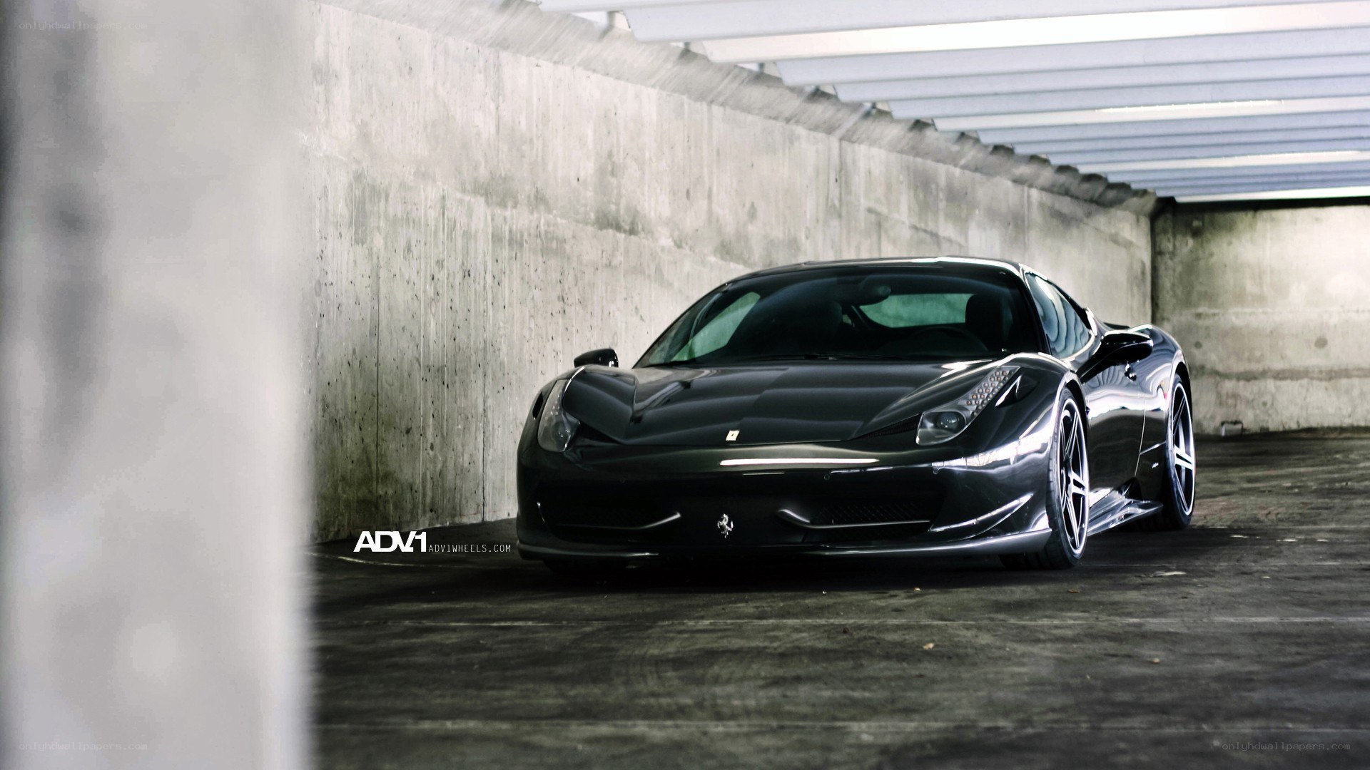 Black Ferrari in a garage