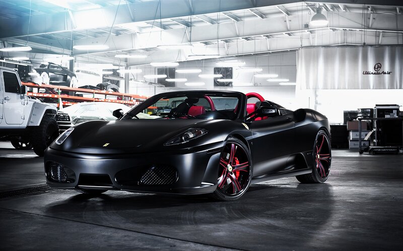 Black Ferrari in a garage