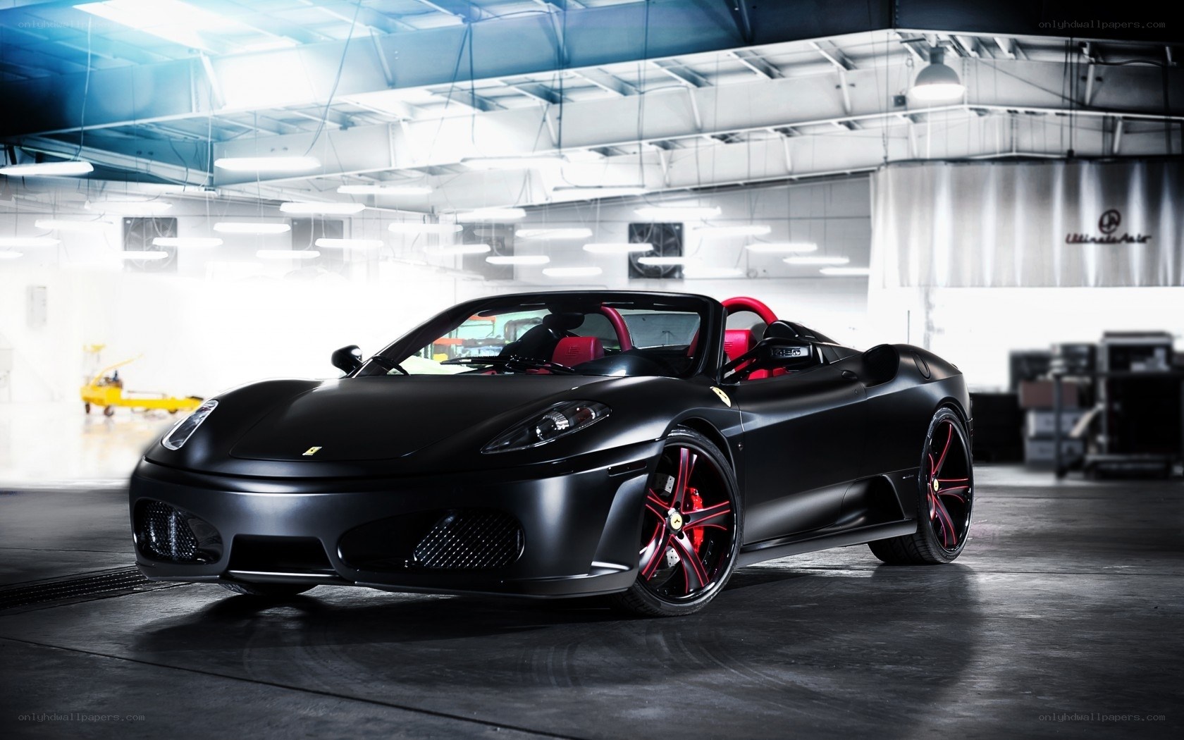 Black Ferrari in a garage