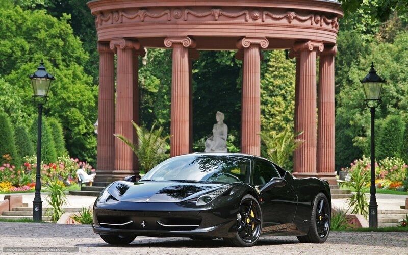 Black Ferrari in a garden