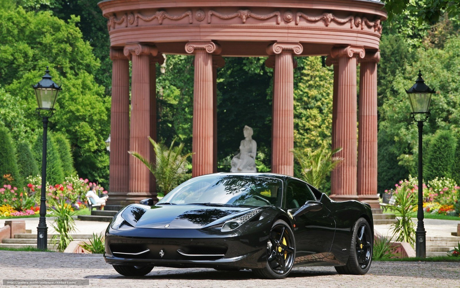 Black Ferrari in a garden