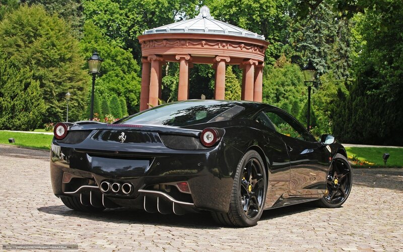 Black Ferrari in a garden