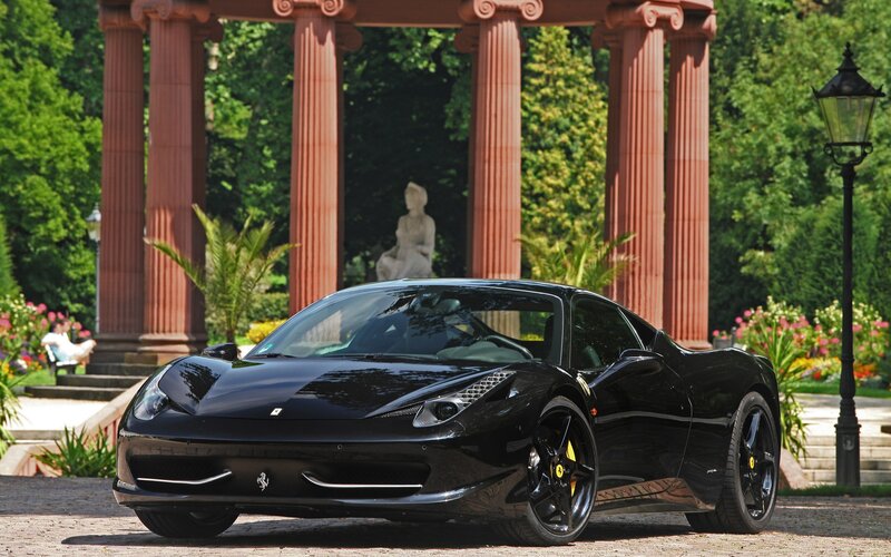 Black Ferrari in a garden