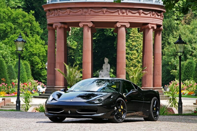 Black Ferrari in a garden