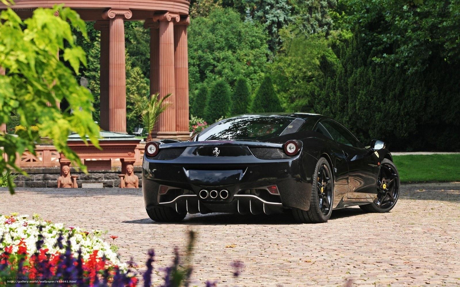Black Ferrari in a garden