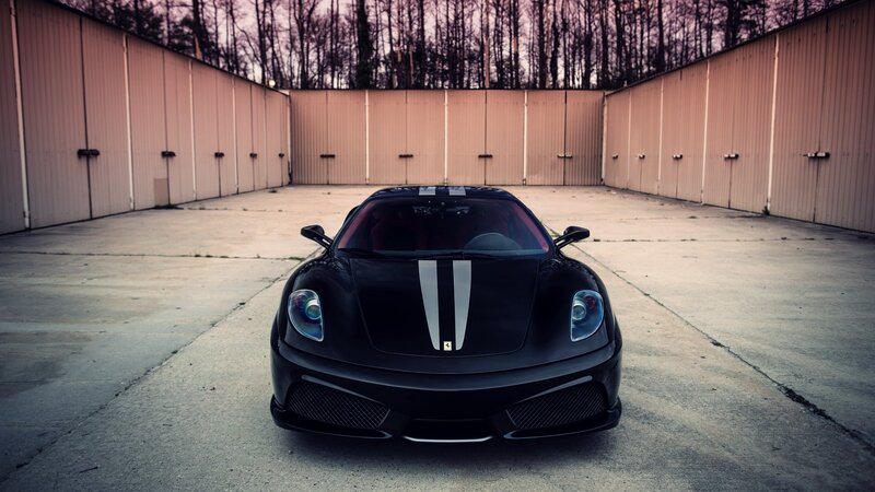 Black Ferrari in a storage yard