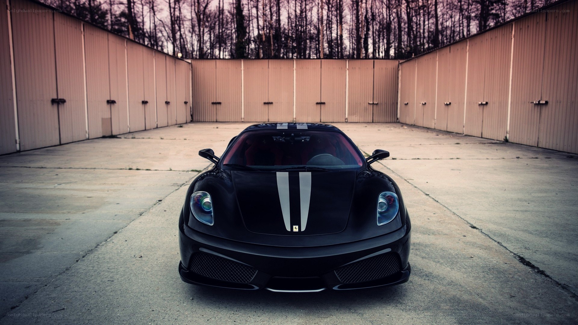 Black Ferrari in a storage yard